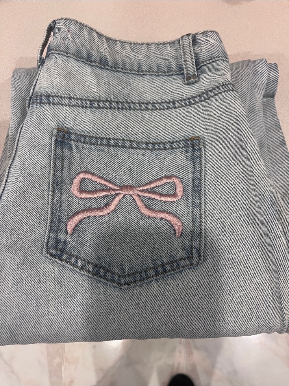 Edikted Light Blue Jeans with Pink Bow Back Pocket - Picture 1 of 4